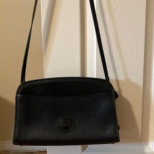 Vintage Dooney and Bourke All weather Leather Crossbody Bag with Embossed Logo
